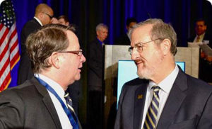 President Mark Schlissel talks with U.S. Sen. Gary Peters